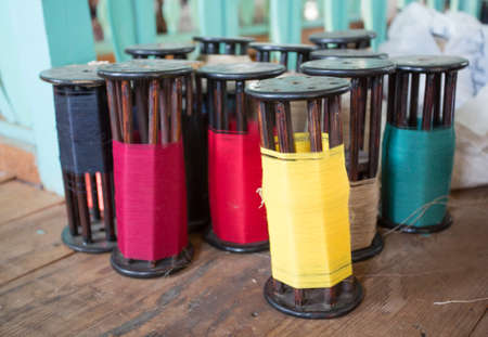 colorful reels on wooden floor