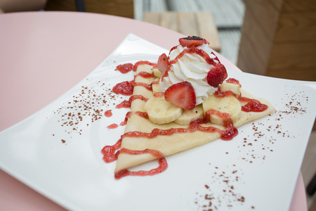 strawberry banana crape on plateの写真素材