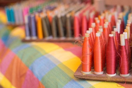 Colorful reels of silk threadsの写真素材