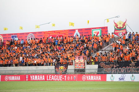 SUKHOTHAI THAILAND-FEBRUARY 14:Fan Club of Sukhothai FC in League One between Sukhothai FC(orange) vs Pattaya United(blue) on February 14, 2015 at Talay Luang Stadiam in Sukhothai Thailandのeditorial素材