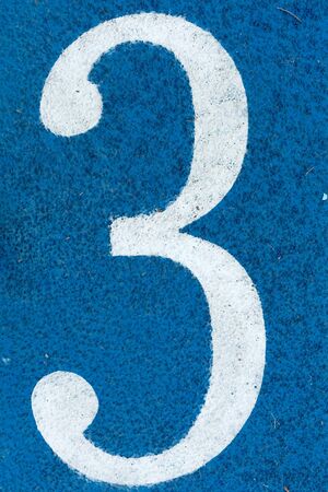 Numbers on blue running trackの写真素材