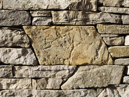 Rough stone wall with large stone space in the midlleの写真素材