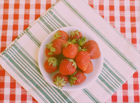 Strawberries on a white plate, top viewの写真素材