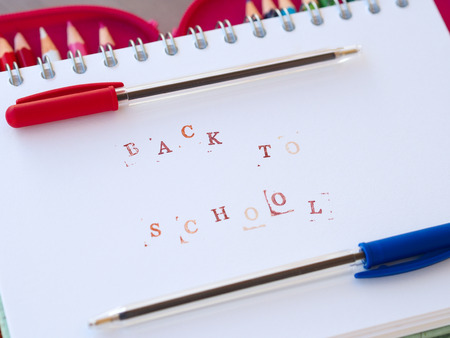 Back to school concept with red and blue pen and color pencils
