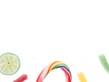 Fruit lollipops and candies isolated on white, copy spaceの写真素材