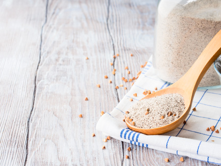 Buckwheat flour on wooden rustic table. Copy spaceの写真素材