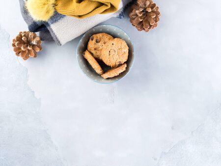 Home winter relax with woolen plaid and chocolate chip cookies. Time for cozy blanket sweater sweet snackの写真素材
