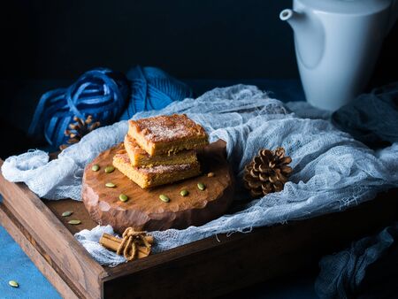 Stacked Christmas spiced pumpkin blondies topped with sugar and cinnamon. Baked square bar treat for...