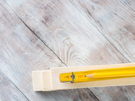 Wooden material pieces and measuring meter yellow pencil tools for bricolage diy hand made craftの写真素材