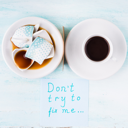 Broken coffee cup and whole one. Relationship concept top view over pastel background. Flat lay squareの写真素材