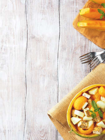 Vegan cantaloupe melon salad with tofu cheese, herbs and cucumber. Healthy summer fresh lunchの写真素材