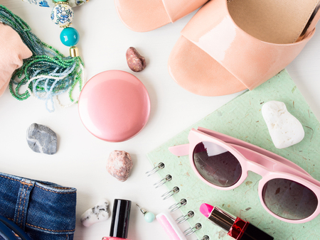 Summer color lifestyle woman clothes flat lay with accessories, make up and sandalsの写真素材