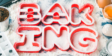 Flour letters spelling Baking with tools and sweet food ingredients sugar, eggs, cocoa, cinnamon. Top view flat lay conceptの写真素材