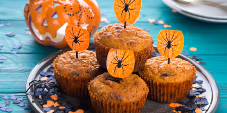 Pumpkin muffins with chocolate chips for Halloween kids party. Holiday decorationsの写真素材