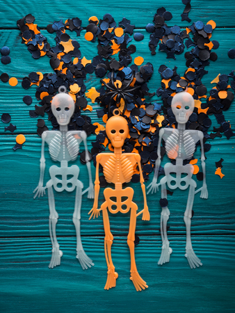Halloween party symbol decorations - skeletons and dark confetti. Holiday invitationの写真素材