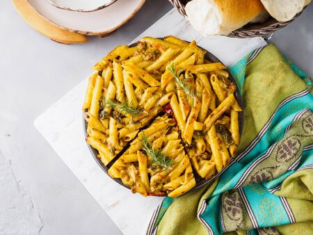 Italian Fried macaroni pizza with penne and bell peppersの写真素材