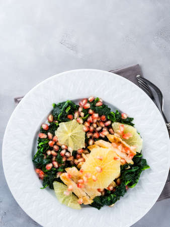 Chicken breast salad with spinach, white pomegranate and grapefruit. Light lunch. Festive winter mealの写真素材