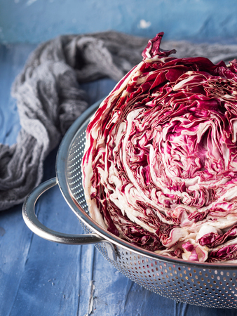 Radicchio red chicory closeup on blue backgroundの写真素材