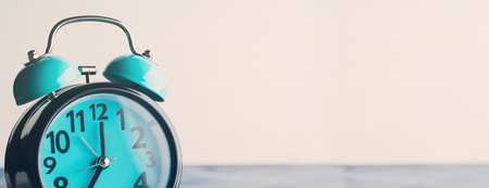 Long banner with blue alarm clock. Waking up, time conceptの写真素材