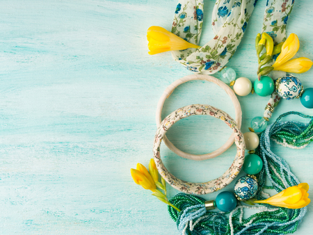 Girls accessories on turquoise pastel background. Flat lay