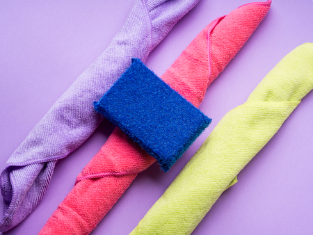 Abstract background with cleaning cloths, sponges. Colorful washing concept