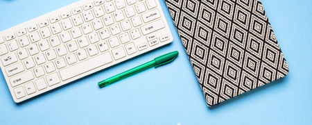 Keyboard, notebook and pen. Writing, studying and blogging concept