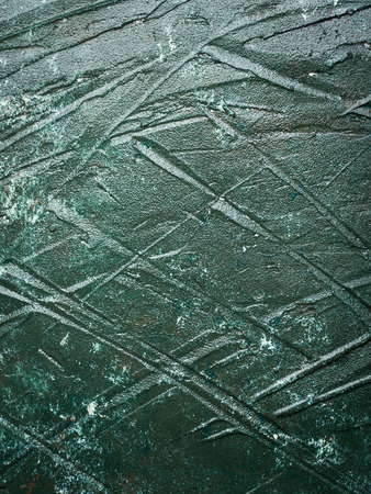 Dark green acrylic painted wooden background with rough textureの写真素材