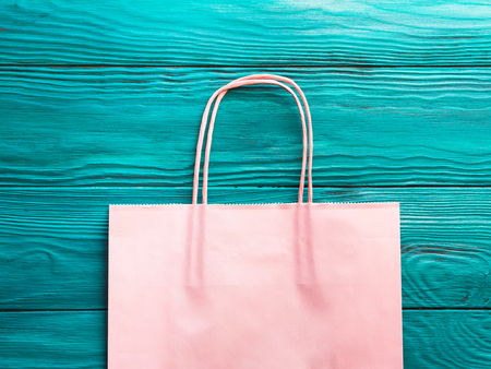 Pink shopping bag on green background. Shopping sale conceptの写真素材