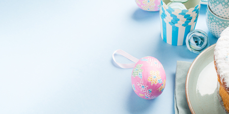 Easter concept background with colorful eggs on pastel blueの写真素材