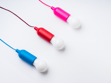 Three color light bulb lamps on white. Conceptの写真素材