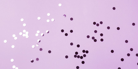 Sparkling silver and pink confetti on purple pastel background. Banner