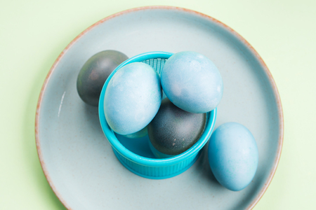 Blue easter eggs on pastel green background. Festive symbol stille lifeの写真素材