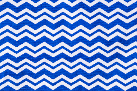 Blue geometrical napkin with white waves. Closeup textureの写真素材