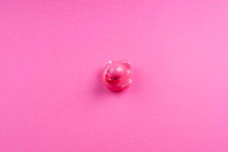 Pink glamour rubber duck with red lips on monochrome background.の写真素材