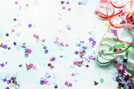 Colorful party festive background with confetti and streamers. Flat layの写真素材