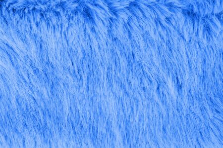 Faux fur detail flat lay monochrome classic blue color of 2020 color background for social mediaの写真素材