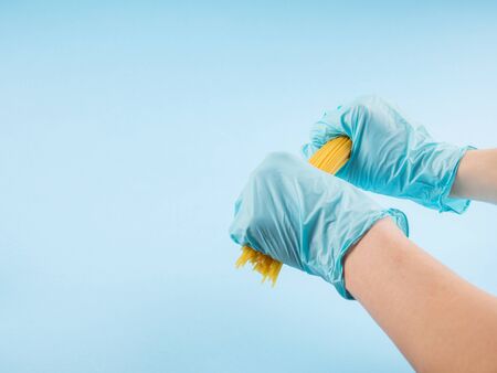Concept of economic crisis in Italy due to Covid-19 pandemic with hands in medical gloves breaking...