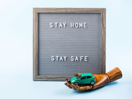 Stay home message text on letter board during covid19 pandemic. Stay safe and protect yourself from coronavirus contagion conceptの写真素材