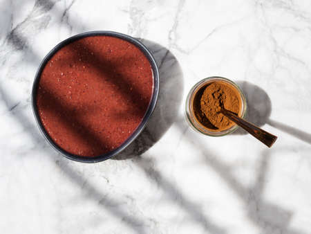 Smoothie bowl with wild berries and chaga mushroom superfood powder. Top viewの写真素材