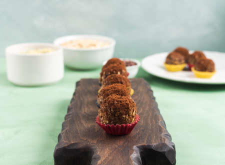 Protein energy balls with cocoa, dried fruit, nut butter and seeds. Healthy dessert, snack.の写真素材