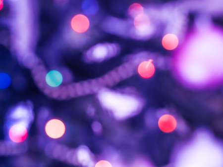 Christmas tree ornament on branches detail blur abstract background. Purple and pink toneの写真素材