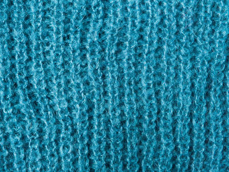 Blue woolen sweater, macro texture background