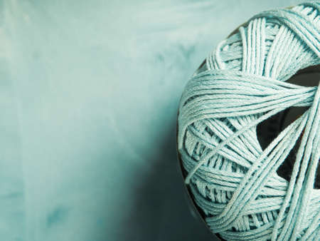Green cotton knitting yarn, macro detail backround with copy space