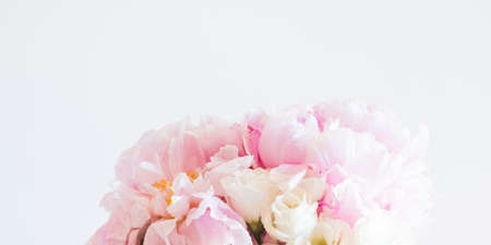 Closeup of pink pastel peony bouquet on gray banner. Floral arrangementの写真素材