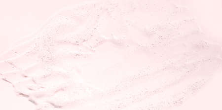 Gel serum face cleanser lotion textured pastel pink backgroundの写真素材