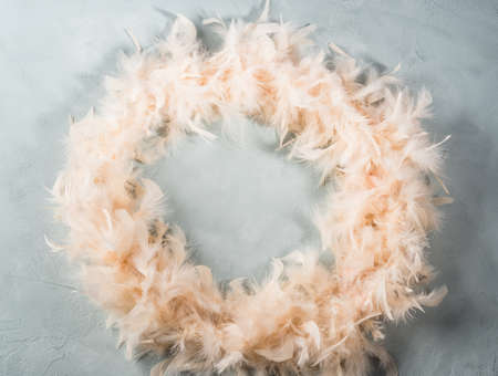 Trendy yellow feather frame on turquoise backgroundの写真素材