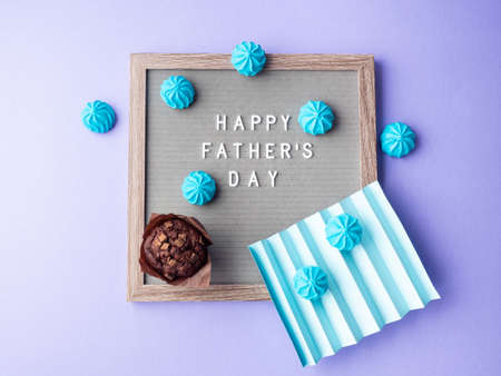 Happy fathers day greeting card with letter board and blue meringuesの写真素材