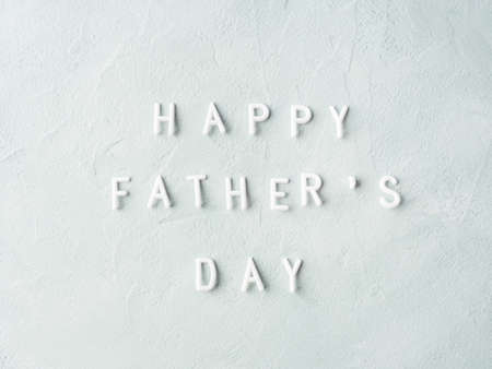 Happy fathers day letters text greeting card on gray stone backgroundの写真素材