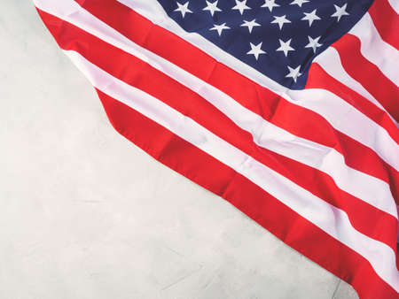 American stars and stripes flag on gray concrete backgroundの写真素材