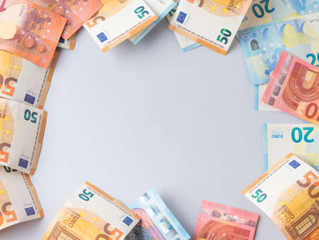 Euro money currency banknotes frame on blue backgroundの写真素材